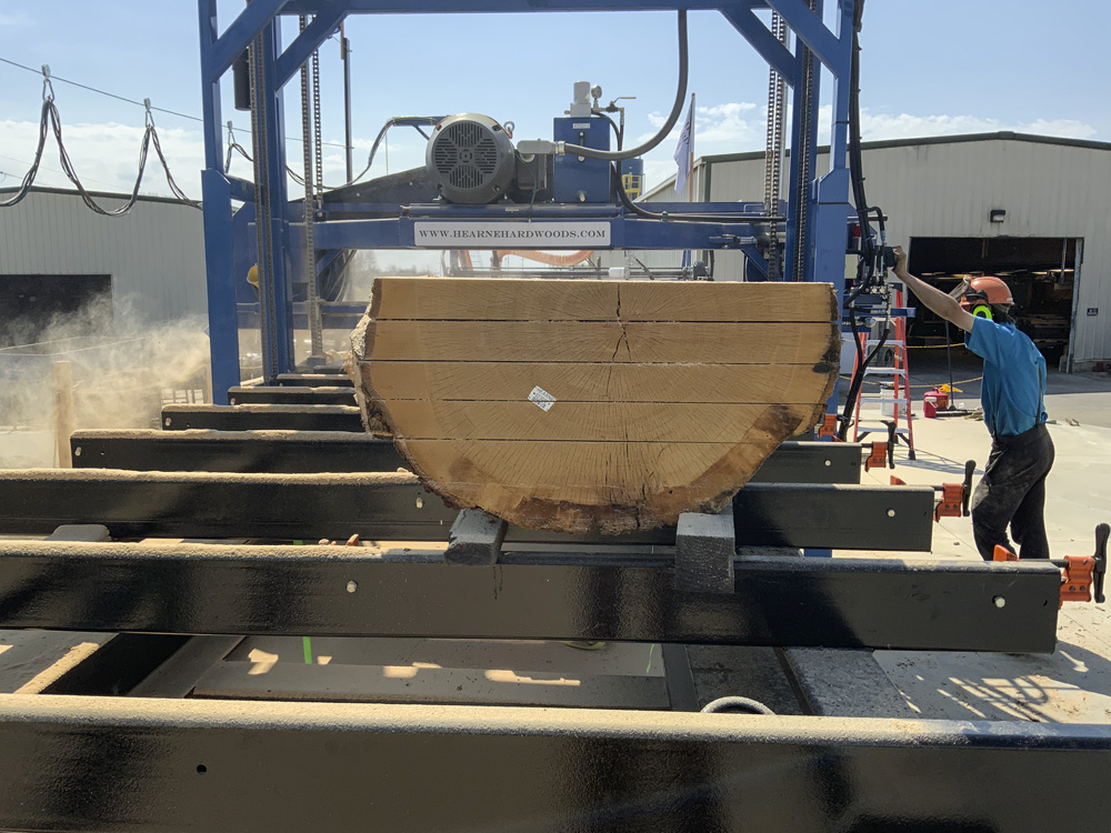 Meet our new sawmill at Hearne Hardwoods Inc - This mill can handle up to 8 feet wide by 45 feet long and as thin as 7mm (about 3/16”)!